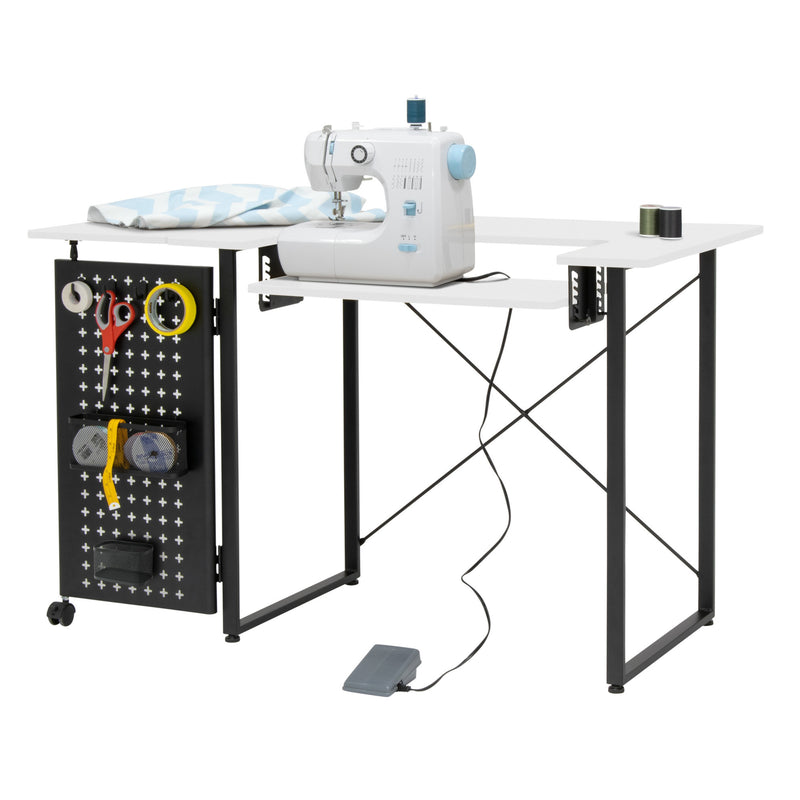 Smart Sewing Table with Fold-Out Storage Panel in Black and White.